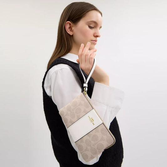 Corner zip wristlet in signature canvas with stripe / Coach