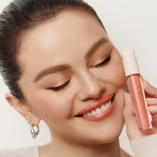 positive light luminizing lip gloss / Rare Beauty