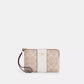 Corner zip wristlet in signature canvas with stripe / Coach